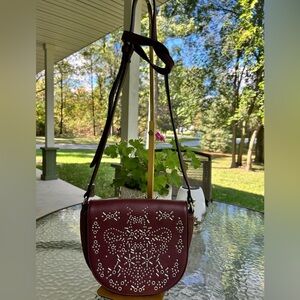 Elegant Burgundy Crossbody Bag with Intricate Design